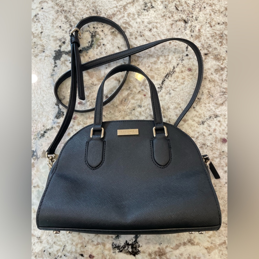 Kate Spade. Black leather cross body purse. 9.5” L x 4” W x 7.5” H